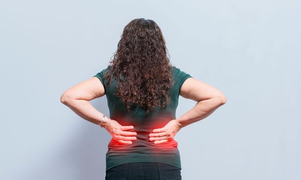 Person with spine problems, woman with back problems on isolated background, Concept of woman with lumbar problems, a sore woman with back pain