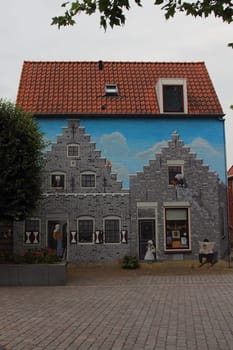 a beautiful graffiti / wall painting of a medieval house in Zierikzee (Zeeland), the Netherlands