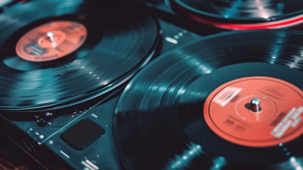 This close-up shot showcases two turntables placed on a table, likely part of a DJ setup. The turntables appear to be in good condition with visible control buttons and vinyl records on the decks.