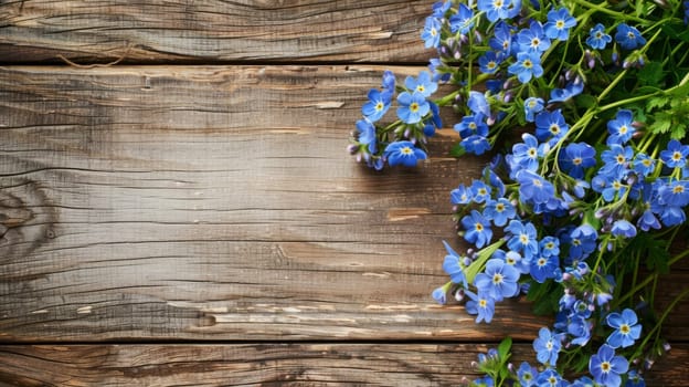A cluster of vibrant blue flowers arranged neatly on a rustic wooden table. The petals and stems bring a pop of color to the simple setting.