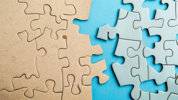 A detailed view of a puzzle spread out on a wooden table. Various puzzle pieces are visible, some connected while others are still separate. The image conveys the process of solving the puzzle.