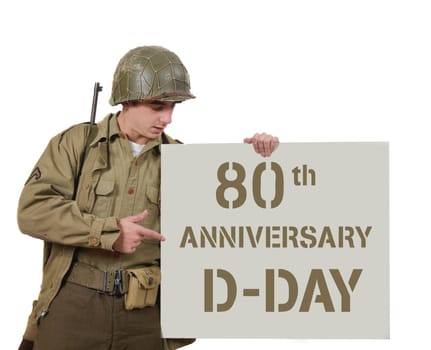 young American soldier with M1 helmet shows a signs 80 th anniversary of D DAY
