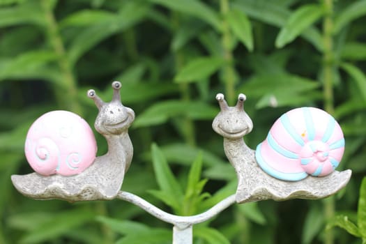 A snail from rusted metal for garden decoration