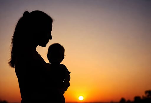 AI generated of silhouette of a mother holding her baby at sunset