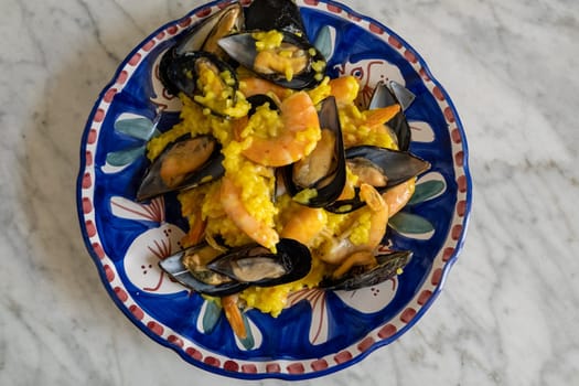 Rice with  mussel safran mix on the plate