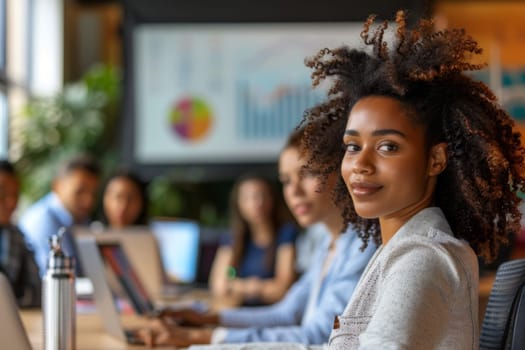 Young businesswoman poses for a portrait with colleagues in the background at a conference