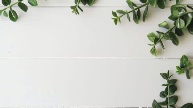 A white table is covered with an abundance of fresh green leaves, creating a vibrant and refreshing display of nature indoors. The leaves are various shapes and sizes, providing a lively and organic texture to the tabletop.