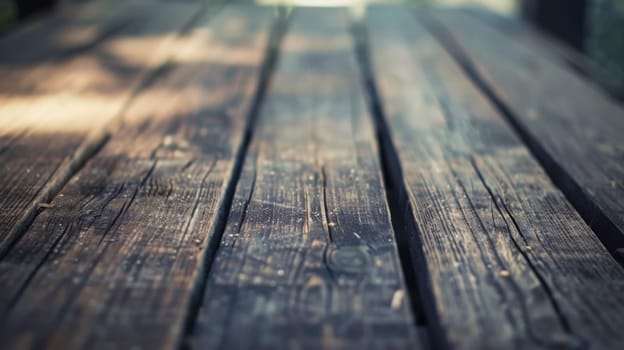 A detailed view of a wooden table is shown up close against a blurred background. The texture of the wood is prominent, and the surface appears to have wear and tear.