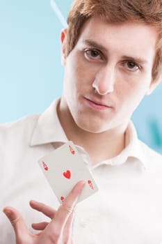 A young redhead man in a blue office pulls out his ace. It illustrates creative problem-solving when following the usual best practices falls short