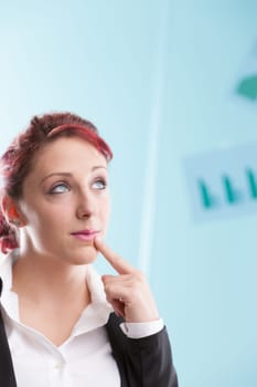 Red-haired young lady, donning a formal suit and unbuttoned white shirt, gazes at her office surroundings. She's optimistic about job roles and sees potential in you, envisioning a perfect team synerg