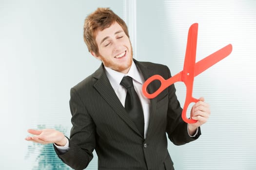 Employer with one scissors in one hand and the other open palm up in a gesture that means 'eh what can you do, my hands are tied, I can't do anything else, I'm forced, these things happen, life is har