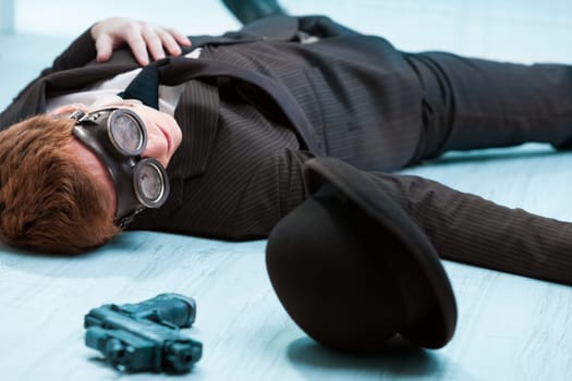 Steampunk agent lies lifeless, slain by his nemesis-lover. Business ends where love and rivalry intertwine