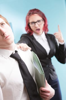Workplace mistreatment: A woman mistreating a man, expressing uncontrolled anger. Unprofessional and unacceptable
