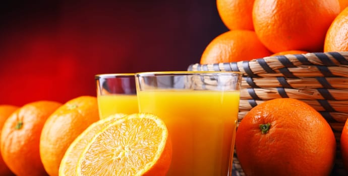 Glasses with freshly squeezed orange juice and fruits