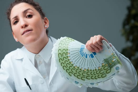 defiant woman, mimicking gangster flair, dons a scientist's coat. Sat at a desk, vast sums symbolize her primary interest. This irony critiques intermediaries that might tarnish the science realm