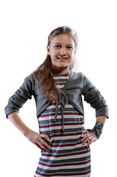 Frontal portrait of a normal, happy girl with a bright smile, wearing a striped dress and grey cardigan, flaunting her long hair
