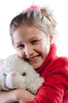 White teddy bear and a girl in a red sweater share a playful bond, full of cuddles, hugs, tossing - a soft and loving companionship