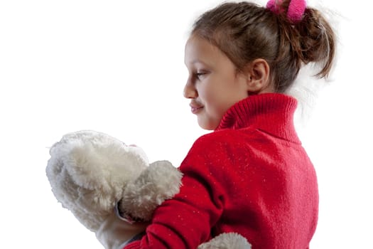 With her white teddy bear, a girl in a red sweater experiences friendship, joy, comfort - it's soft, loving and always there for her
