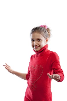 Wearing a red sweater with a sparkling heart and jeans, a girl dances to pop music. With a pink ribbon in her hair, she is an ordinary girl, before adulthood