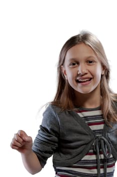 Portrait of a smiling girl in a striped dress and grey sweater. She has long hair and radiates everyday happiness