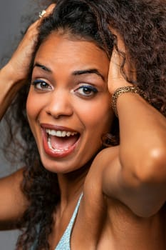 brown-skinned beauty dances, feeling every positive vibration. Sunlight, nature, and music amplify her spirit, making her an embodiment of universal energy and undeniable charm