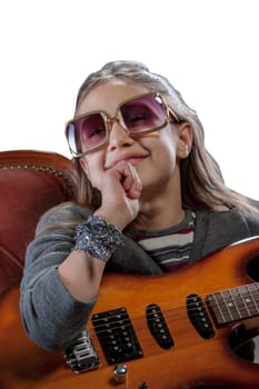 Imaginary pop-rock star, a young girl with an electric guitar, sunglasses, perched on a velvet baroque armchair, basking in adulation