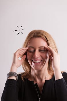 Gently smiling, a woman around 40 remembers a previously overlooked task. Without fuss, she calmly accepts the lapse and proceeds to act, embracing the moment with joy