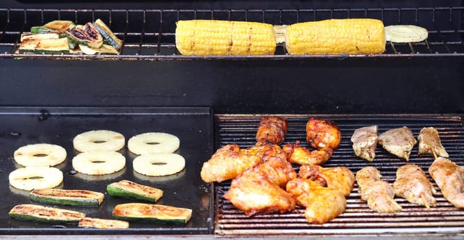 Several pieces of grilled meat on a grill