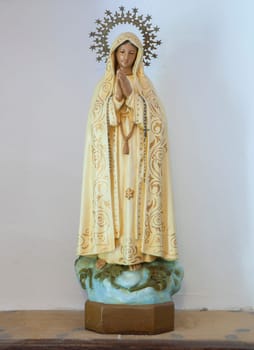 Losar de la Vera, Spain - Augt 8th, 2022: Domestic figurine of Our Lady of Fatima. These itinerant chapels are shared among several neighbors