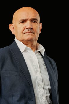 Portrayed formally, a bald elderly man in a jacket and relaxed white shirt bears a look of scorn. He sees the youth as inferior, unlike his days of boldly jumping ditches