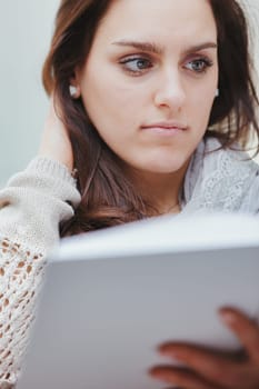 Reading is always challenging, as is studying. At the same time it is tiring and sucks up energy and at the same time it nourishes us and fills us with knowledge and new diverse energies. Young woman