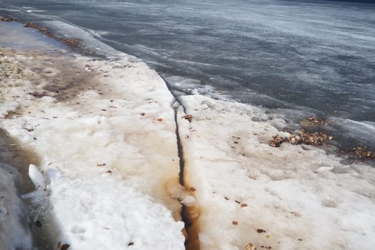 Ice drift in spring on Lake Onega, Karelia. Dangerous thin spring ice in April. Aggregate accumulations of fine-crystalline grains. Opening of small lakes, ponds and reservoirs. Crushed ice floes.