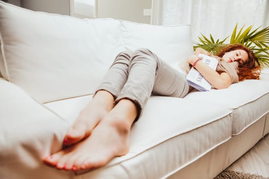 Relaxed and barefoot, an alluring woman with a keen intellect takes a break from business and stocks. While her attire spells elegance, her bare feet evoke ease. 'Today's tasks are done," she thinks,"
