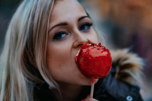 Enjoying a caramel apple, a blonde woman takes in the sumptuous art and architecture that stand as hallmarks of Western civilization. Dual delights for sight and taste