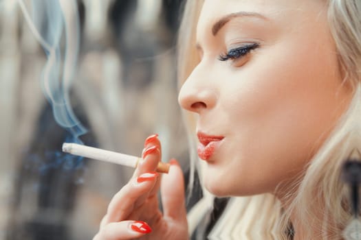 Captured in close detail, a young woman smokes in an age-old European town. She poses as a rebel but is ironically held captive by what she once considered a mere pleasure. Smoking is scientifically p