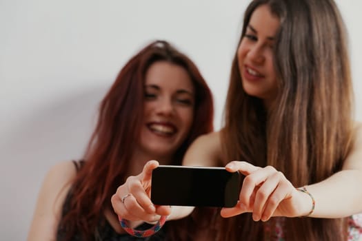 While enjoying their beauty and smartphones, they remain conscious of society's future judgmental gaze