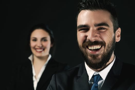 Image depicts a focused man and a blurred woman as legal or government officials, underscoring the significant role of choosing sides for winning