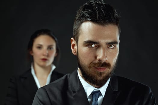 intense man and potentially stronger woman as officials, illustrating the importance of deciding alliance or opposition in achieving victory
