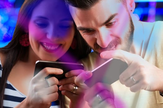 couple competes in a video game on smartphones. Ill win! she exclaims. He retorts, Think again, watch this! Beyond useful apps and access to human knowledge, smartphones have also repla