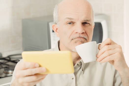 Elderly man, phone in hand, looks skeptical. Fake news makes him feel naive, but he's not. He values critical thinking and verifying sources. Yet, he's tempted, sensing deception everywhere