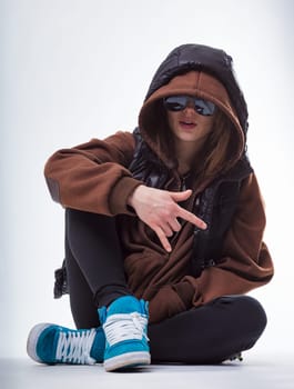 Youthful female, face obscured, exudes an air of introspection