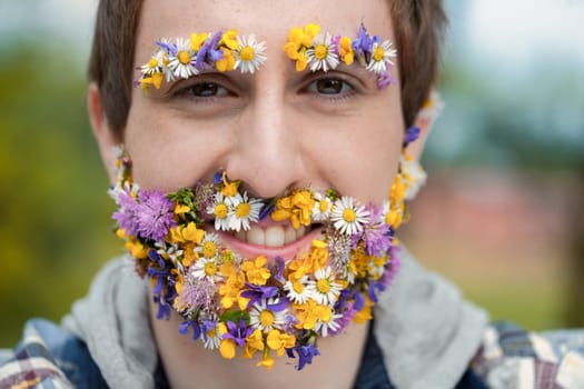 man's face is a floral canvas in the forest. This, either a vivid imagination or reality, stresses his bond with the environment. Cherishing peace, he immerses himself in nature's wonders