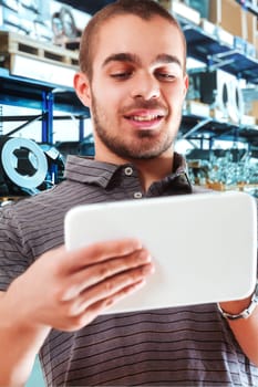 Tech-savvy worker happily engaging with digital inventory system
