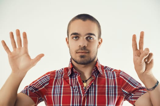 Youth indicates number seven with a confident hand pose