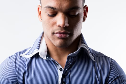 Affluent black man, high-earning middle class, in a blue polo shirt. Appears thoughtful, possibly worried. His troubles remind us that life is hard for everyone, regardless of wealth