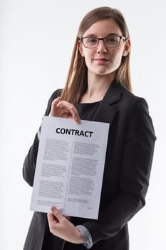 Professional attire and demeanor, woman presents legal paperwork