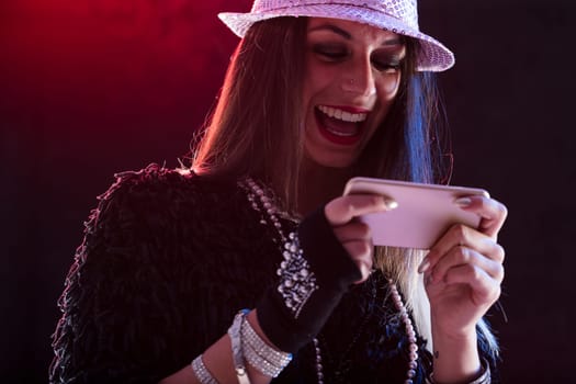A young lady envisions herself as a performer, engrossed in a live show on her phone. She's incredibly moved by the dance video or pop concert. Yeah!