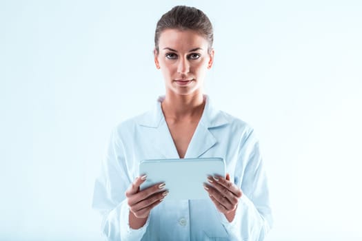 Scientific woman with a white tablet, navigating STEM sectors with precision and skepticism against predatory journals. She meticulously verifies and delves deeper