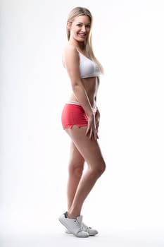 Casual sportswear model projects health and happiness with her smile