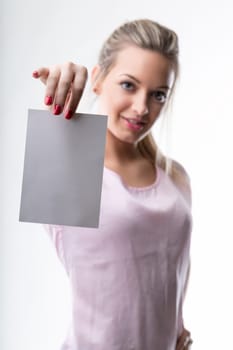 Model presents an empty paper, perfect for advertising or communication